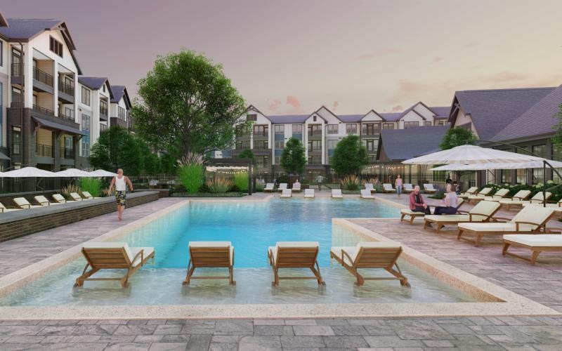 a pool with a sun deck and lounge chairs