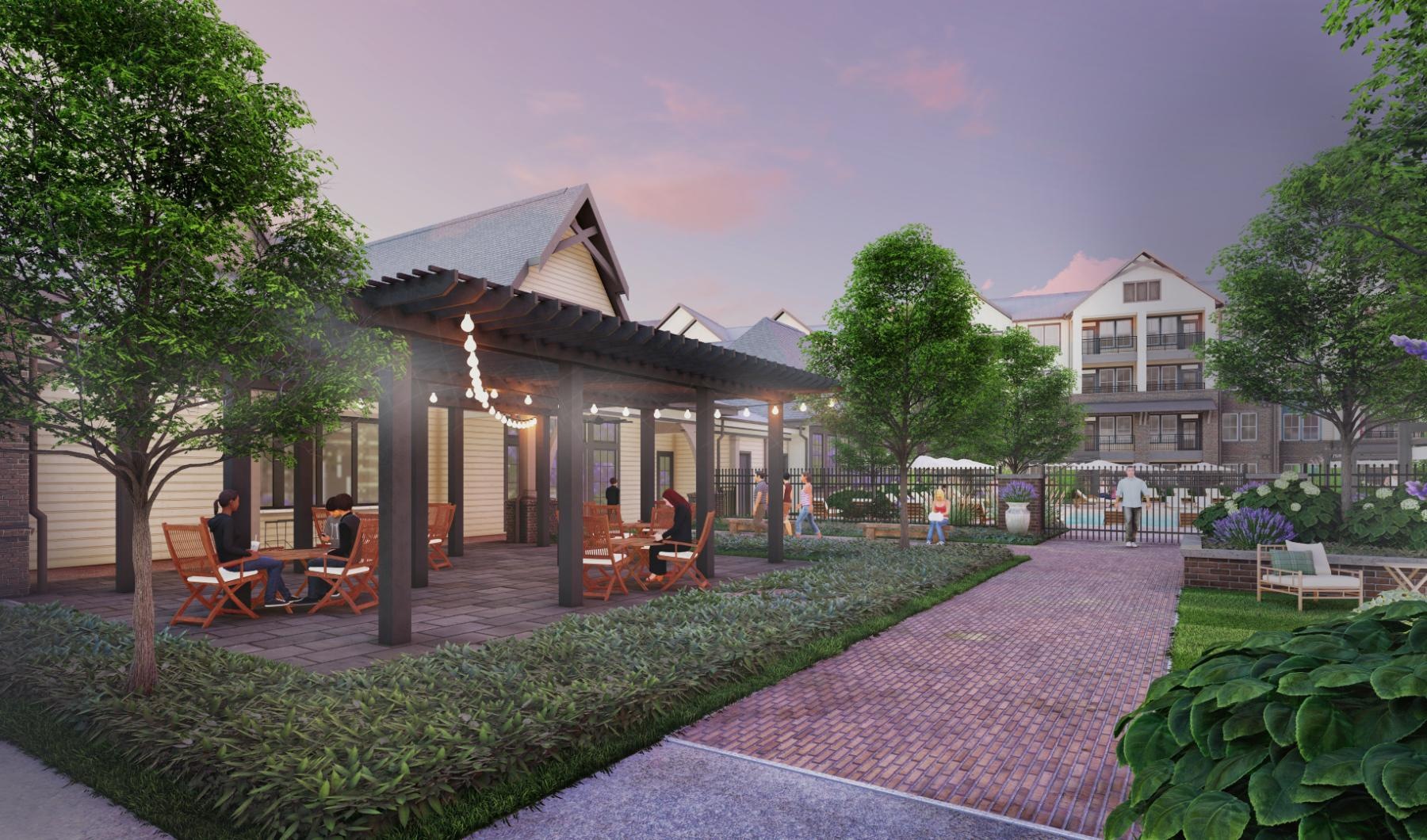 people sitting outside in a courtyard near a pool