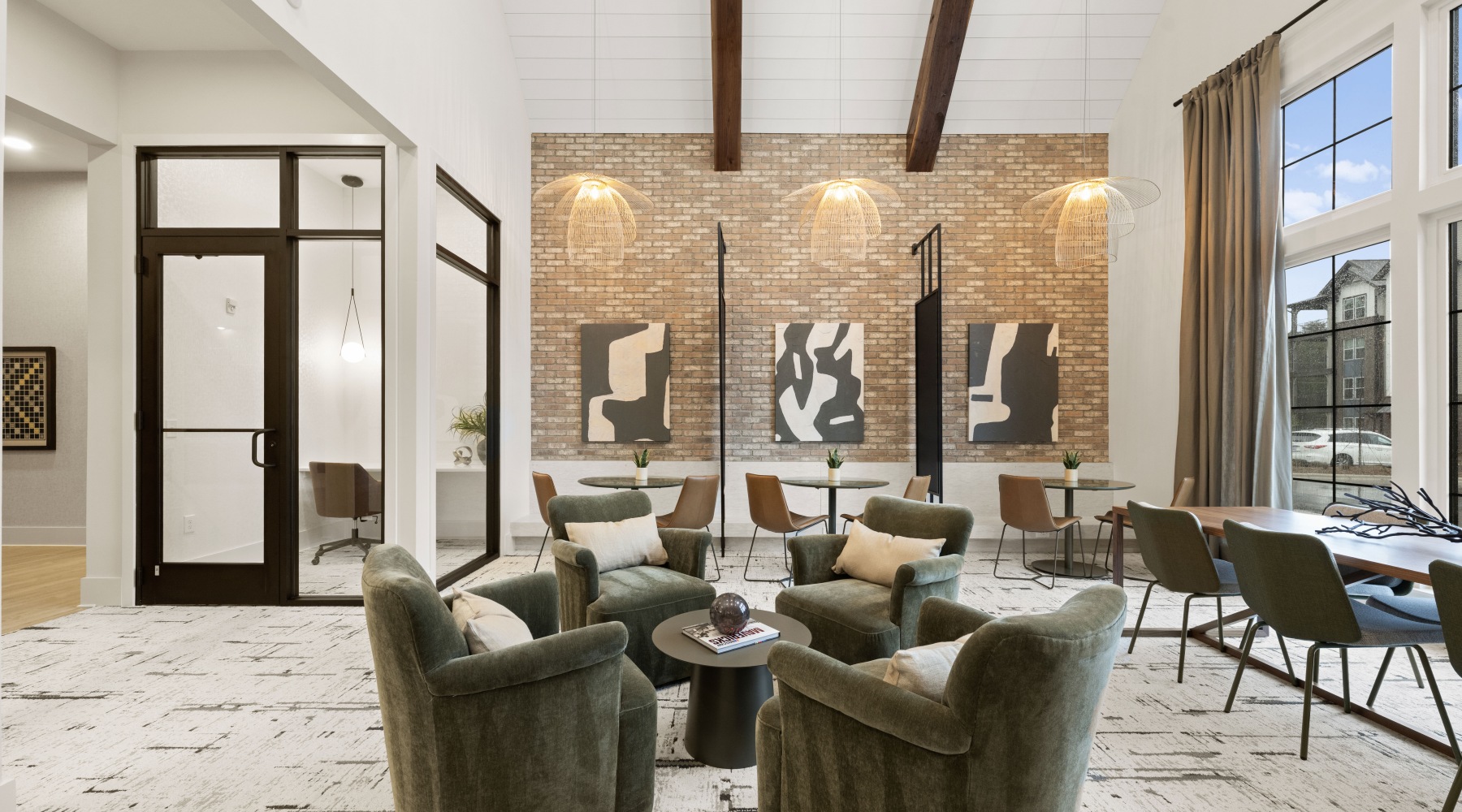 co-working space with seating area, desk area and private office pods