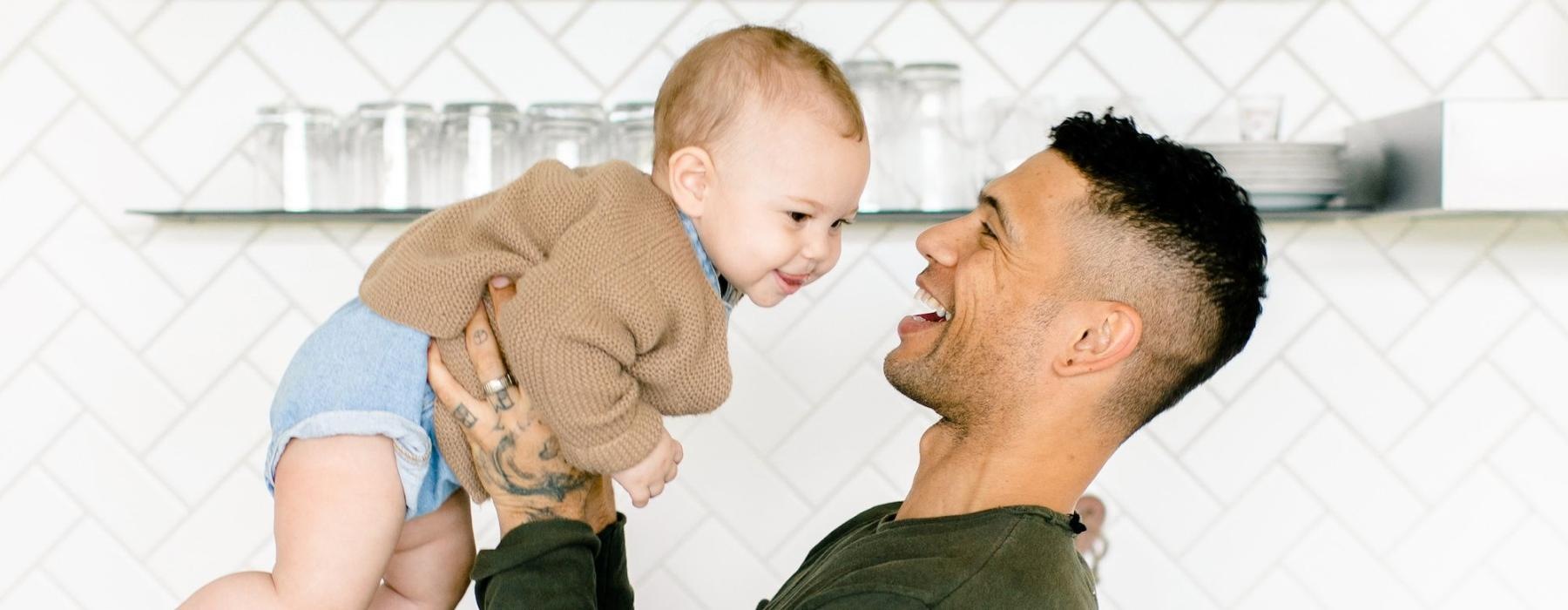 a man holding a baby